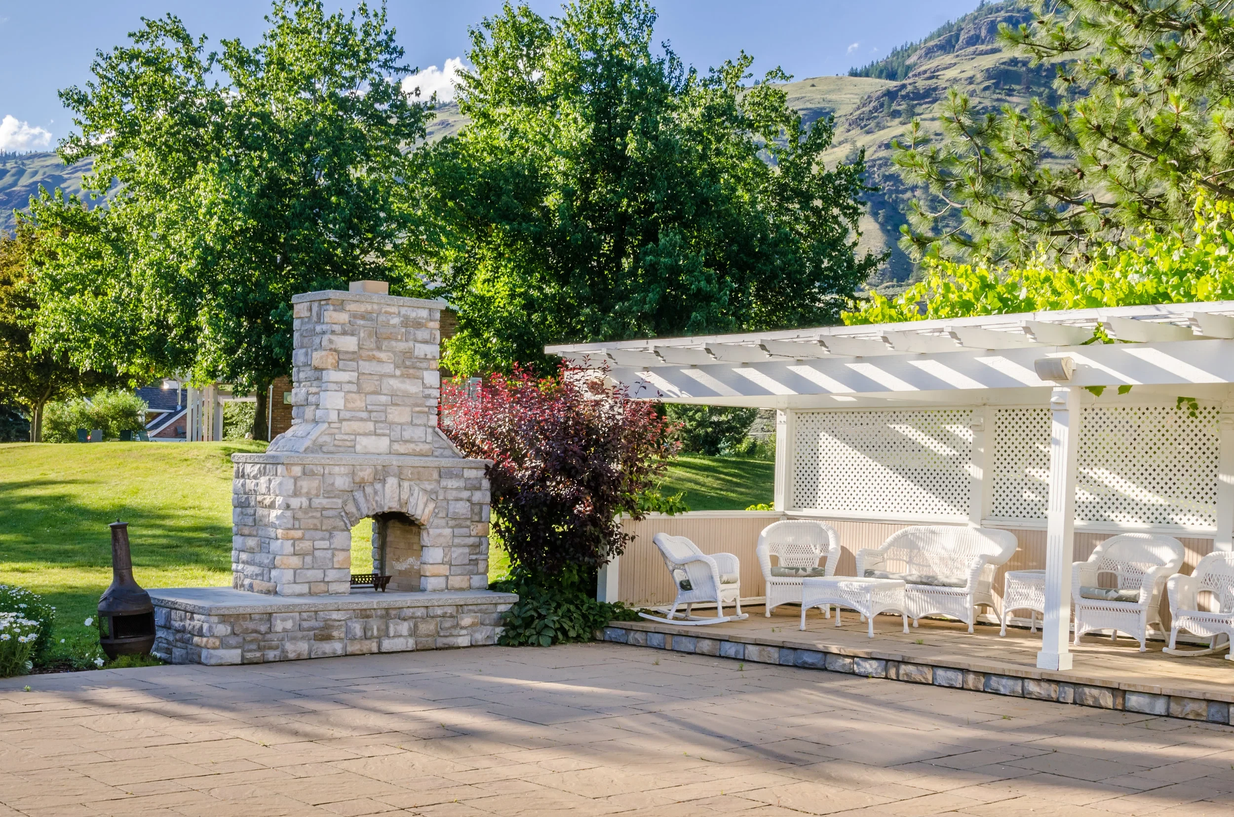 Backyard patio fireplace with mountain views