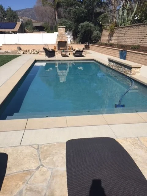 Backyard pool with fireplace